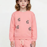 Close-up of embroidered cats on pink organic cotton sweatshirt Slopes and Town