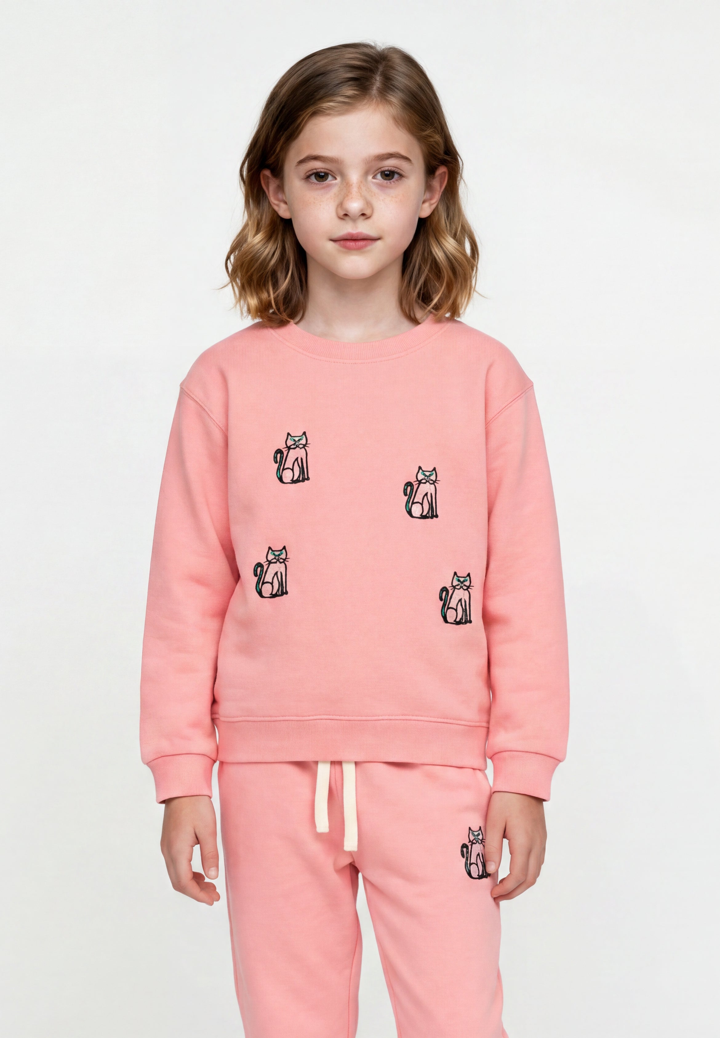 Close-up of embroidered cats on pink organic cotton sweatshirt Slopes and Town