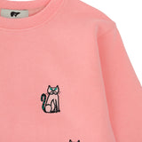 Pink kids’ tracksuit top with embroidered cat design