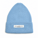 A light blue ribbed knit beanie hat with a white rectangular brand patch on the front cuff that reads 'slopes&town amsterdam'. The beanie is photographed flat against a clean white background.