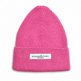 A bright pink ribbed knit beanie hat with a folded cuff and a small white brand label reading 'slopes&town amsterdam' on the front, shown against a plain white background.