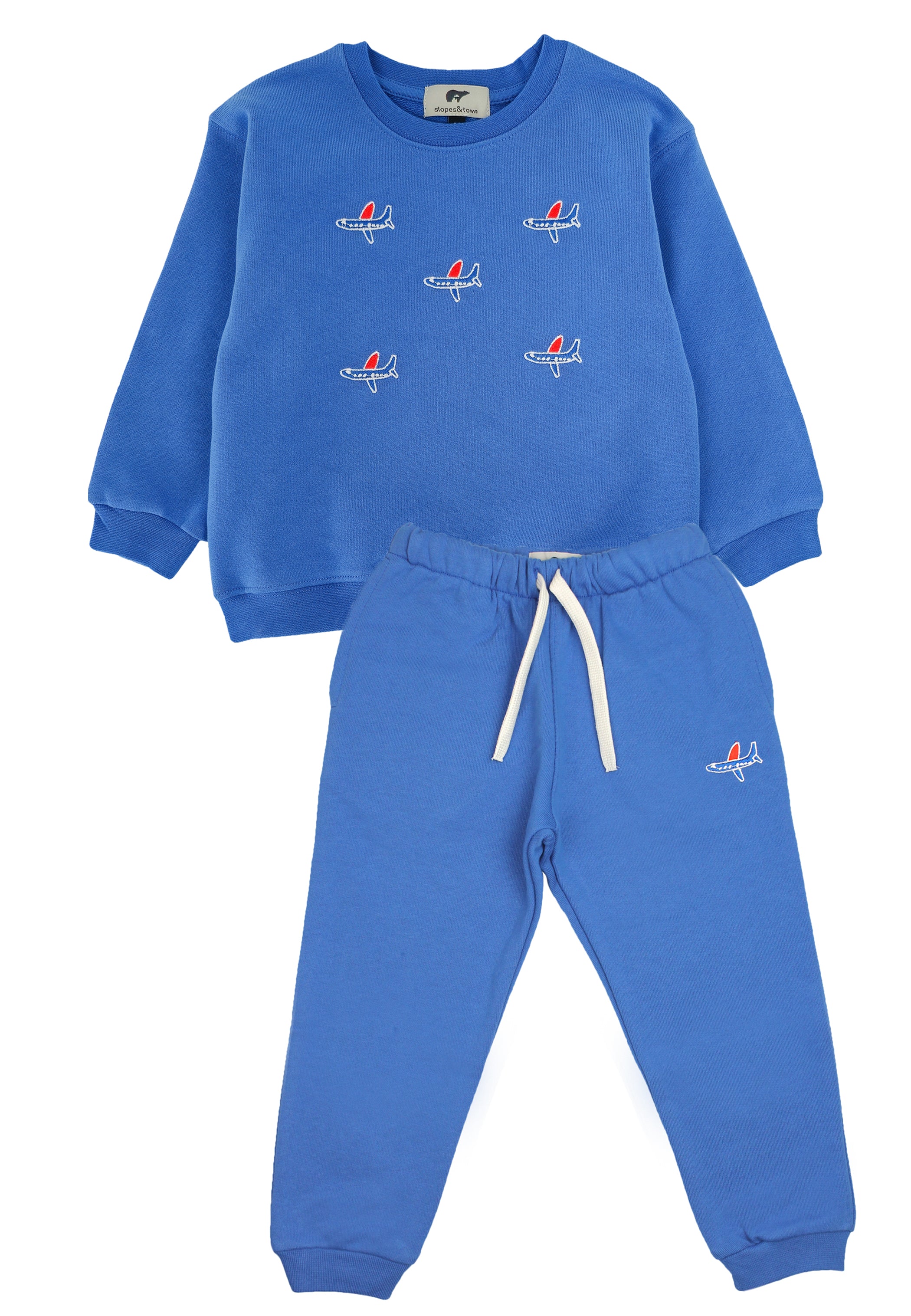 Slopes and Town Kids blue organic cotton tracksuit with embroidered airplane design
