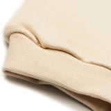 Beige children's joggers with embroidered white terrier dog
