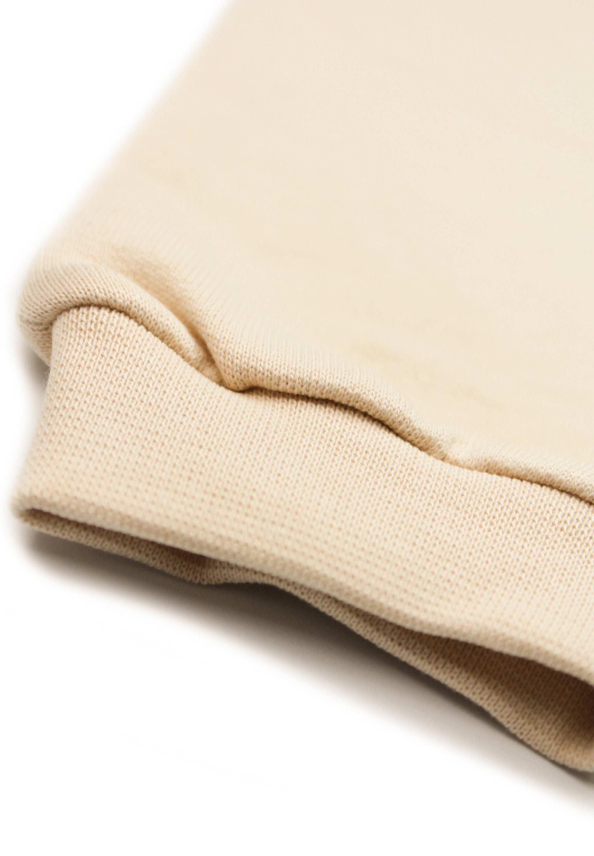 Beige children's joggers with embroidered white terrier dog