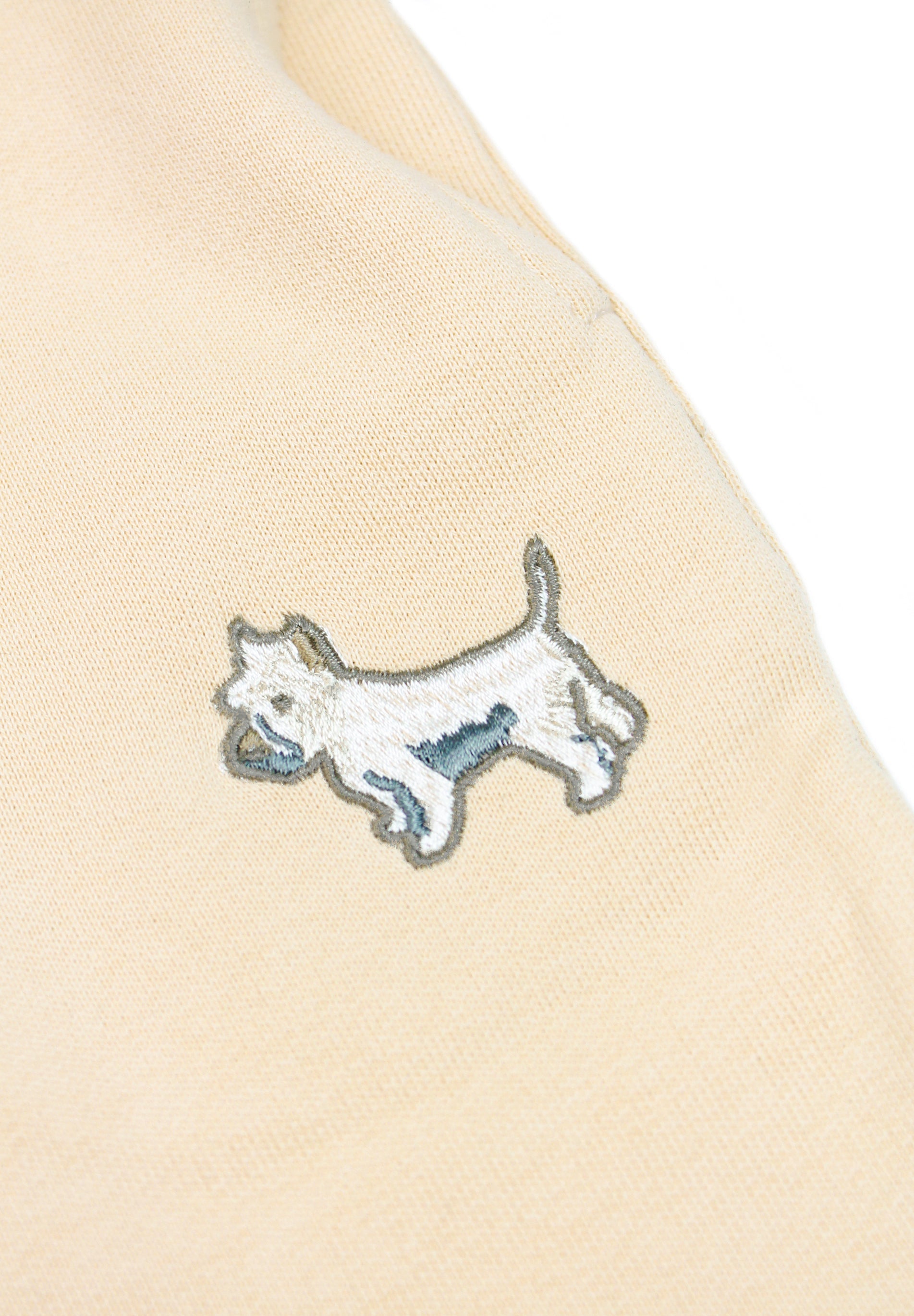 Kids' cream tracksuit featuring embroidered white terrier dog