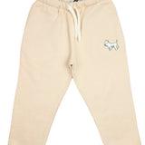 Slopes and Town Kids beige organic cotton sweatpants with embroidered white terrier design