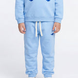 Kids' blue sweatpants featuring shark embroidery
