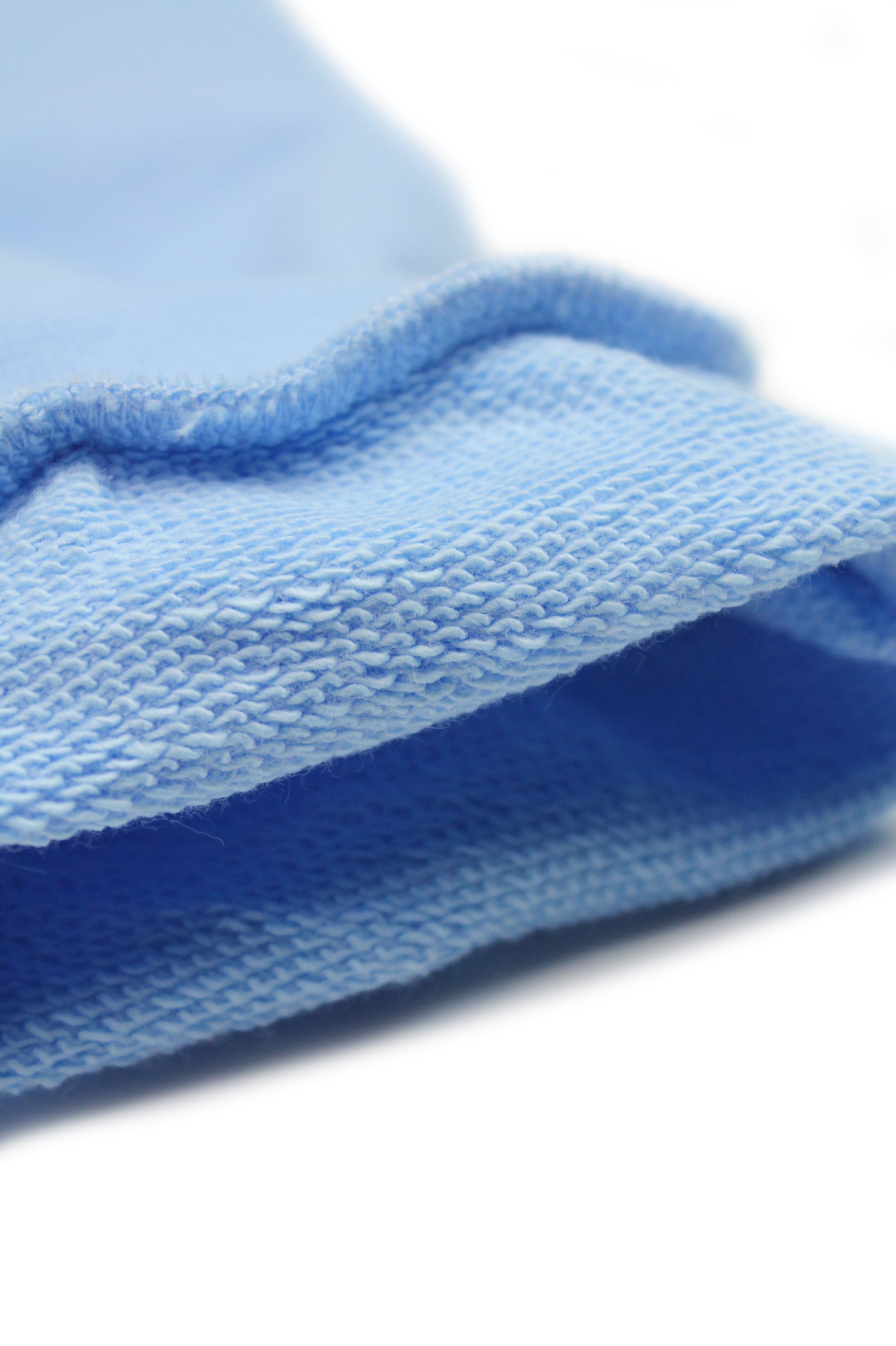 Blue kids' organic cotton sweatpants with bold shark design