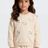 Cream kids' sweatshirt with white puppy embroidery