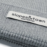 Kids merino wool beanie in melange grey, ribbed knit texture and folded cuff detail