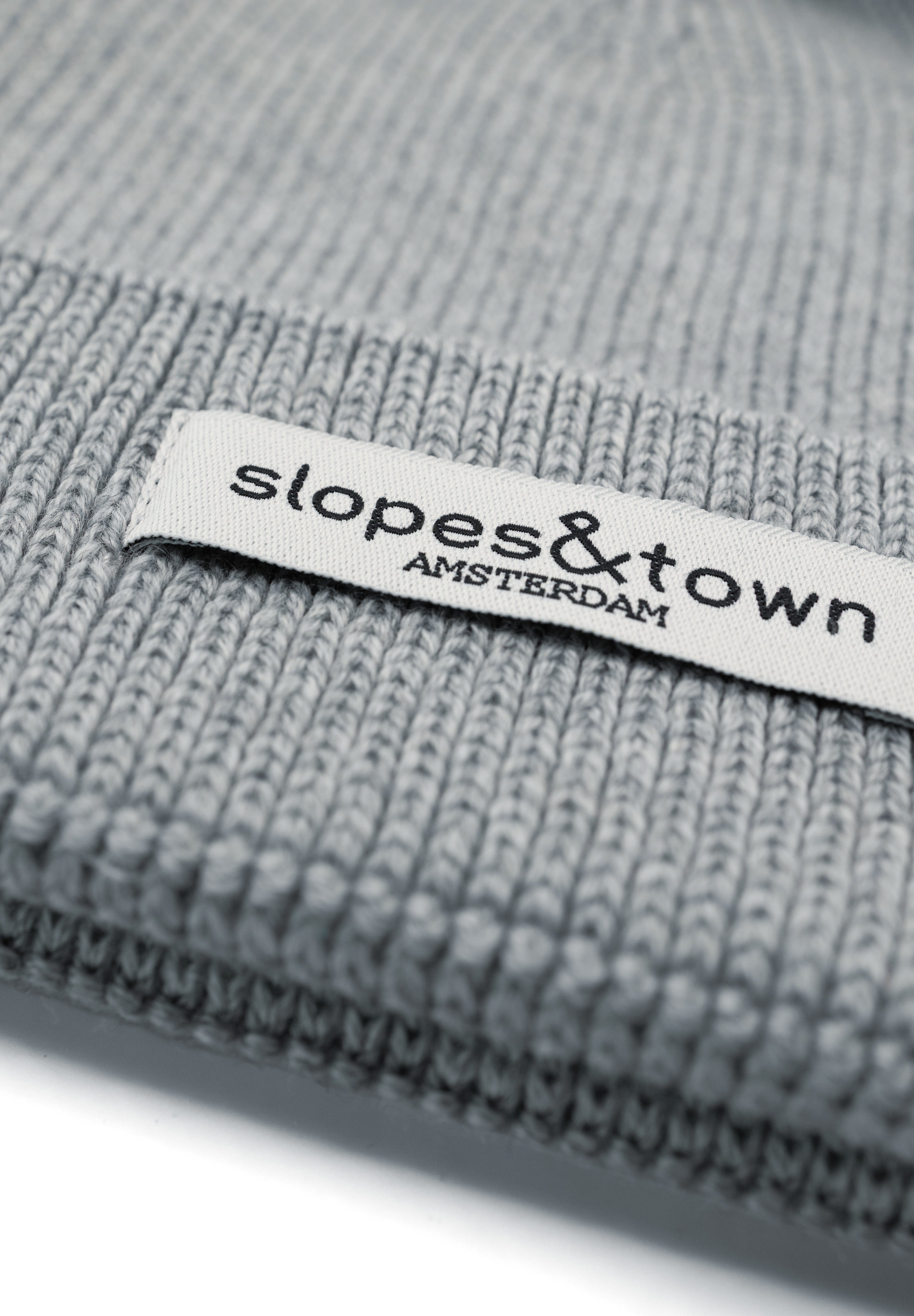 Kids merino wool beanie in melange grey, ribbed knit texture and folded cuff detail