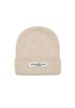 Kids merino wool beanie in latte beige, front view with Slopes and Town Amsterdam woven label