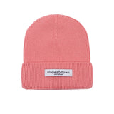Kids merino wool beanie in Lemonade pink, front view with Slopes and Town Amsterdam woven label