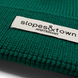 kids merino wool beanie in soft pine green, ribbed knit texture and folded cuff detail