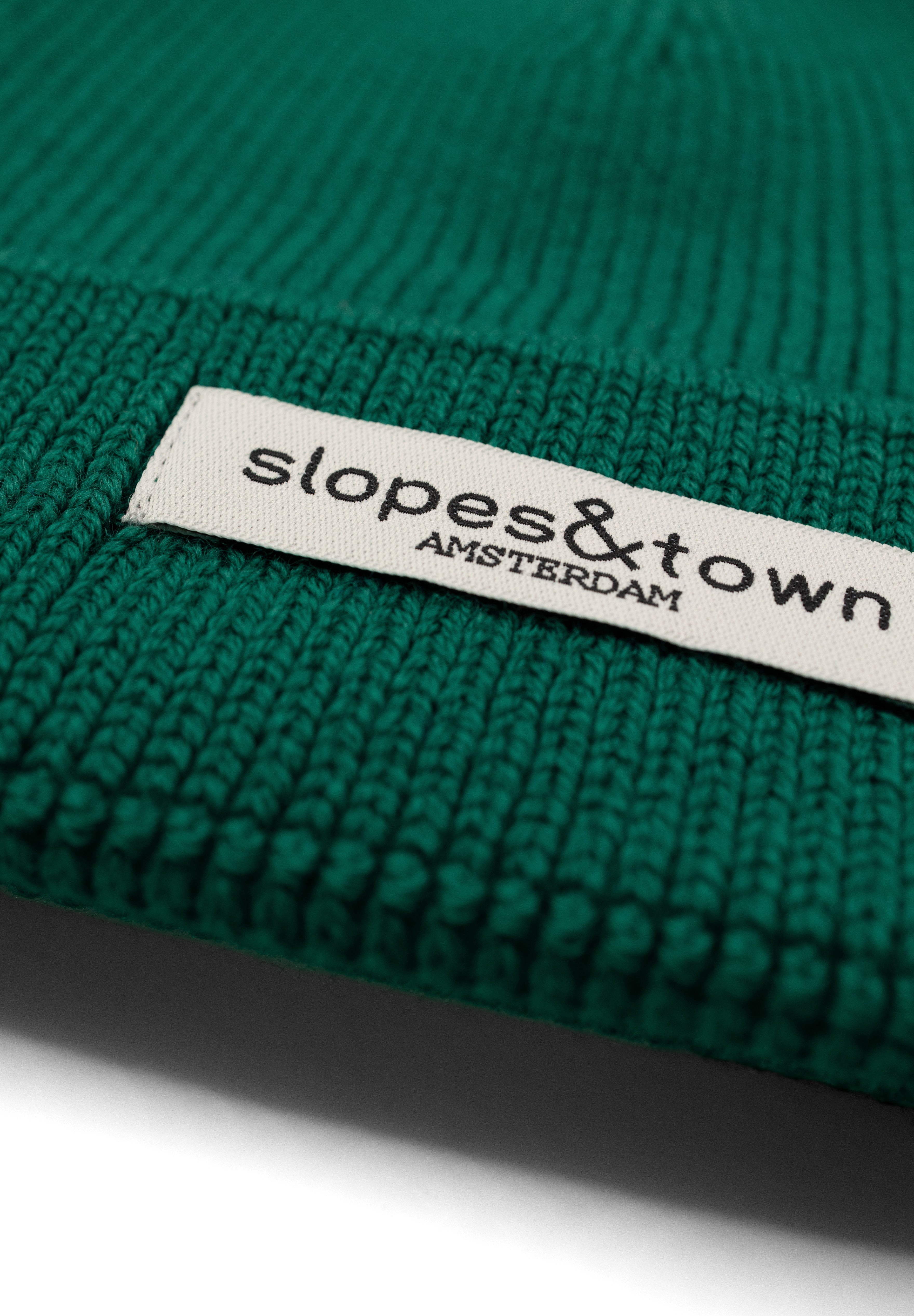 kids merino wool beanie in soft pine green, ribbed knit texture and folded cuff detail