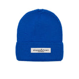 Kids merino wool beanie in electric blue, front view with Slopes and Town Amsterdam woven label