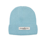 Kids merino wool beanie in light blue, front view with Slopes and Town Amsterdam woven label