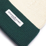 Fine merino wool knit detail on a green kids beanie