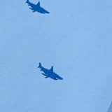 Close-up of shark embroidery on blue kids’ tracksuit