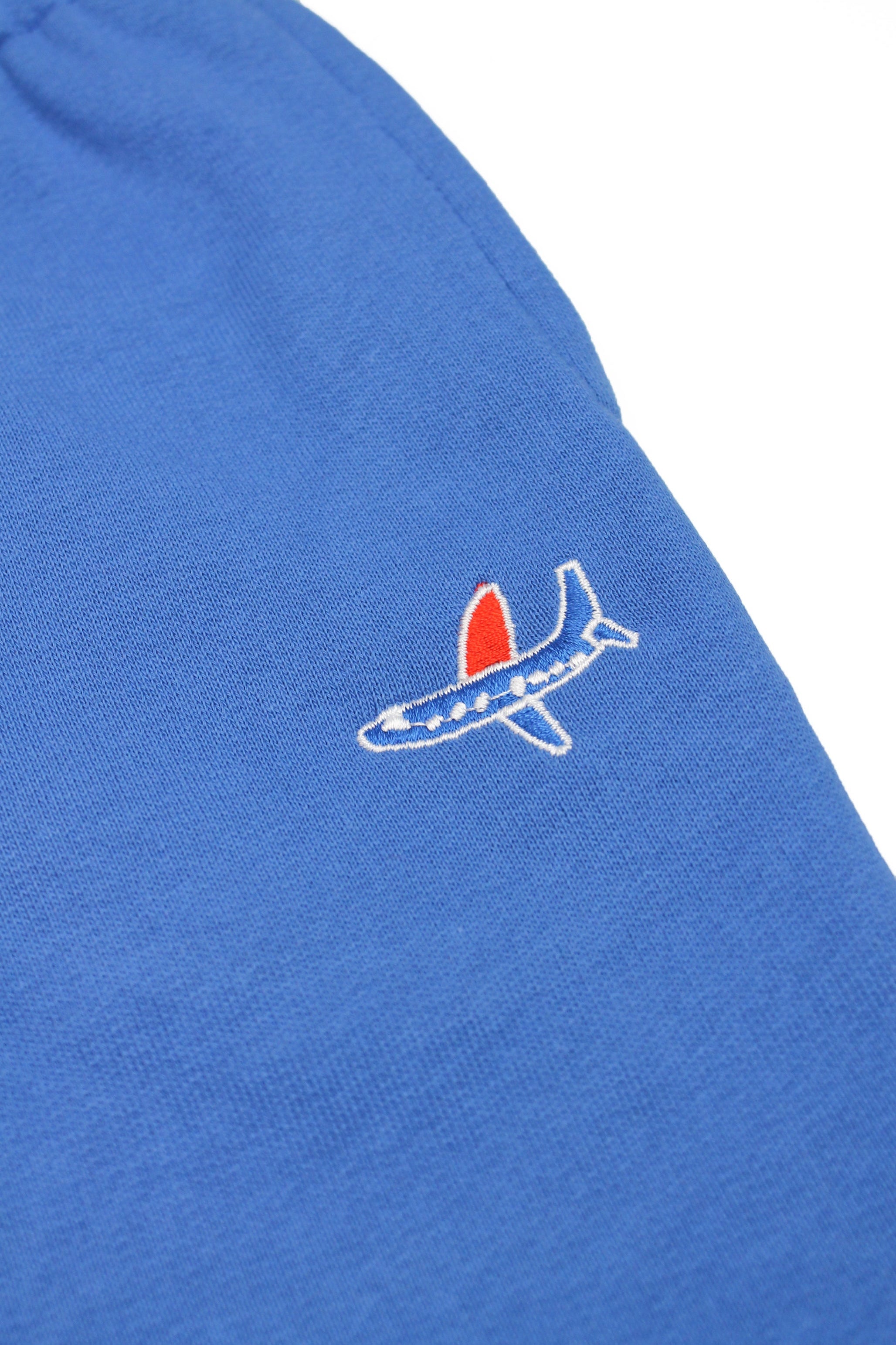Kids' blue sweatpants featuring airplane embroidery