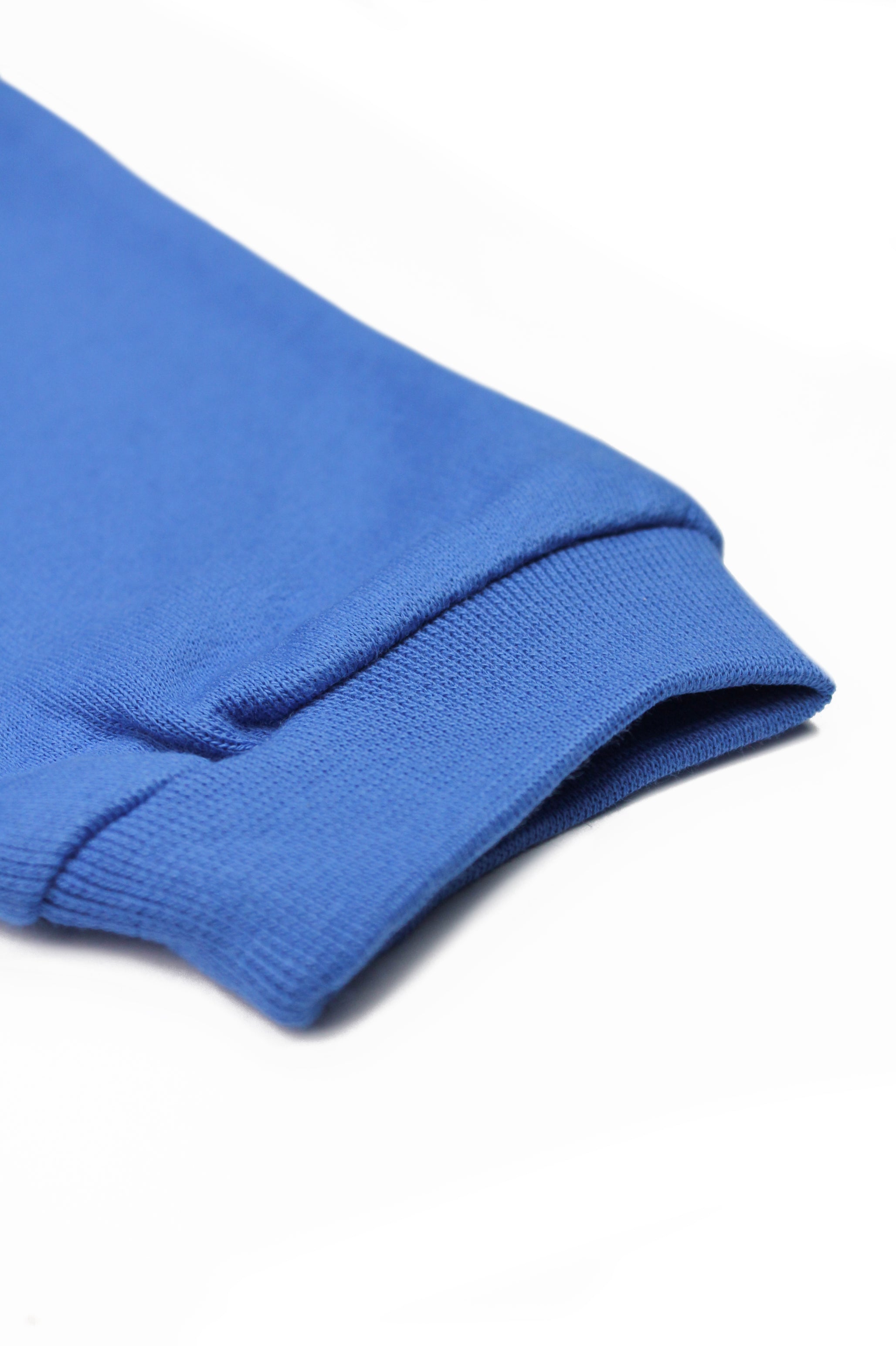 Blue children's joggers with embroidered airplane design