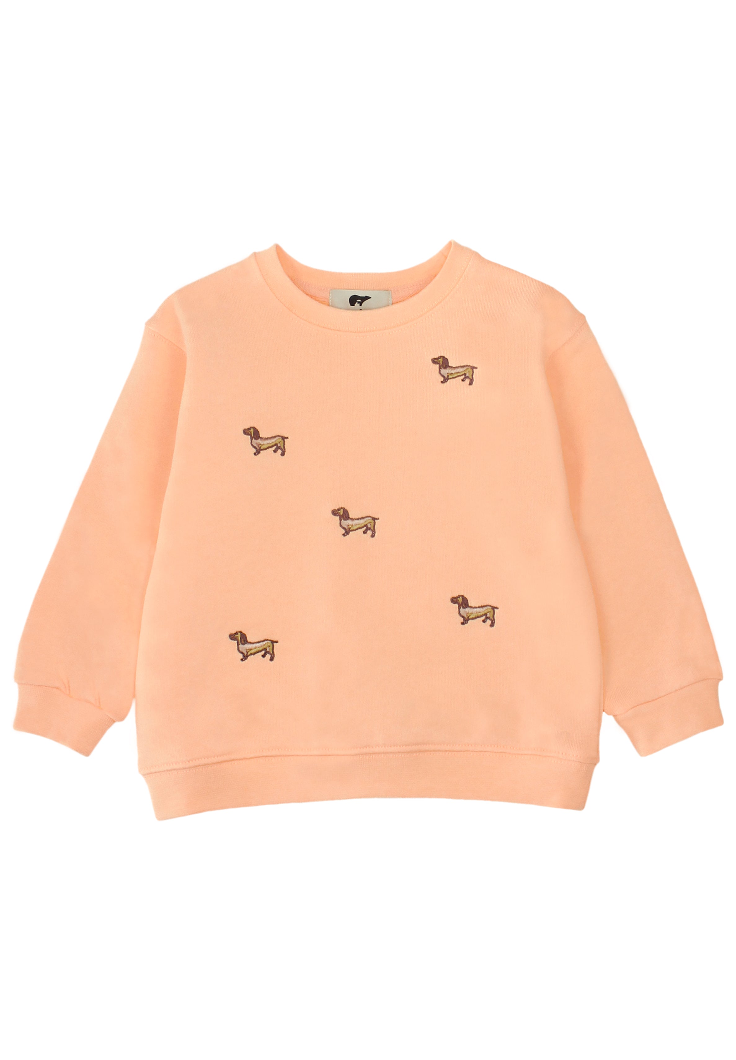 A peach-colored crewneck Slopes and Town sweatshirt featuring embroidered dachshund motifs scattered across the front, displayed on a clean white background.