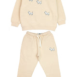 Child wearing beige kids' sweatpants with matching white terrier sweatshirt