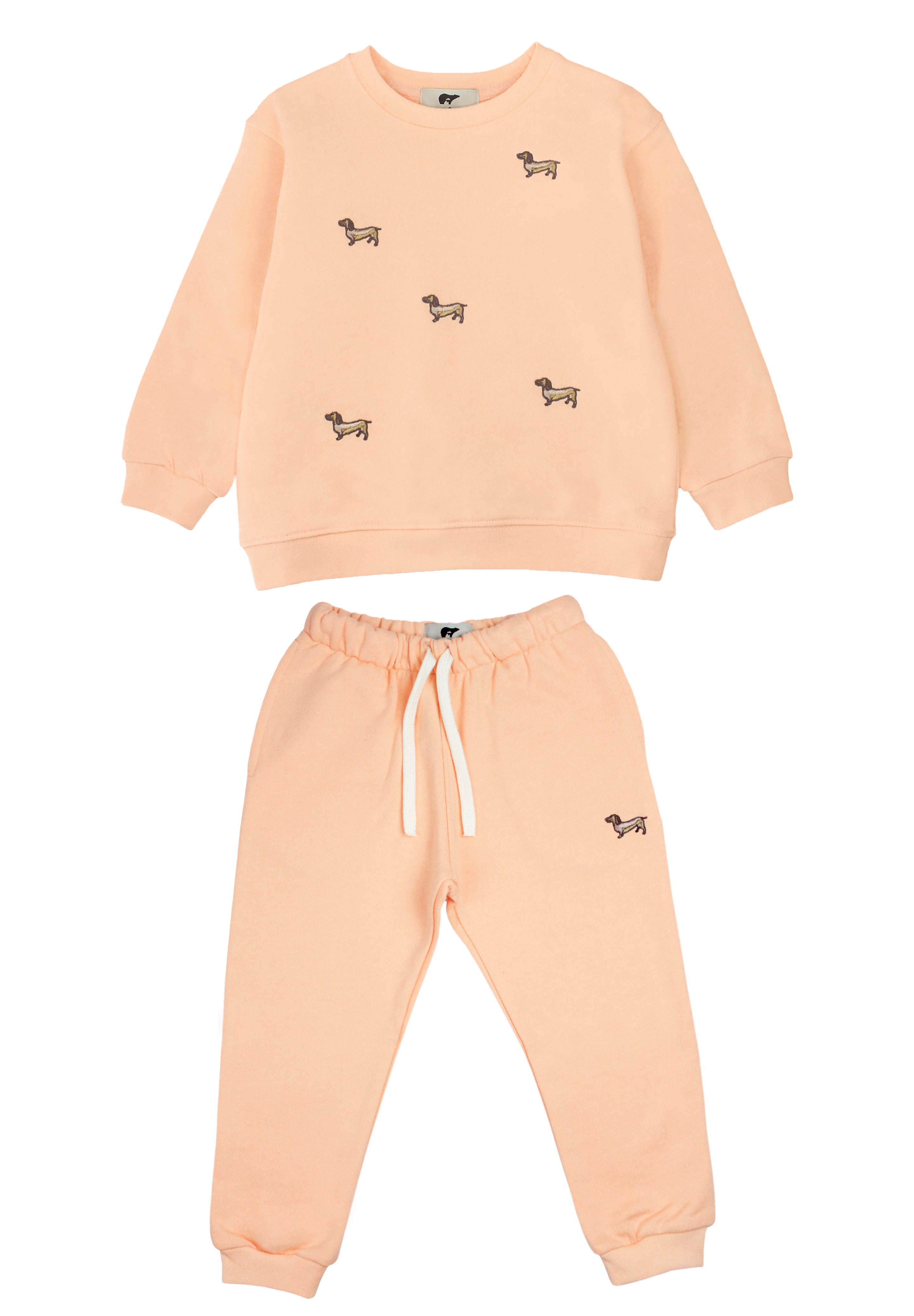 Slopes and Town Kids peach organic cotton tracksuit with embroidered sausage dog design