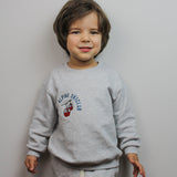 Kids' tracksuit with red gondola and snowy mountain lift design