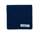 Kids merino wool snood in navy blue, front view with Slopes and Town Amsterdam woven label