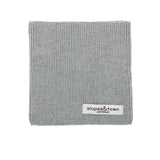 Kids merino wool snood in melange grey, front view with Slopes and Town Amsterdam woven label