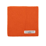 Kids merino wool snood in orange, front view with Slopes and Town Amsterdam woven label