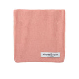 Kids merino wool snood in soft pink, front view with Slopes and Town Amsterdam woven label