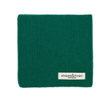 Kids merino wool snood in pine green, front view with Slopes and Town Amsterdam woven label