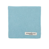 Kids merino wool snood in light blue, front view with Slopes and Town Amsterdam woven label