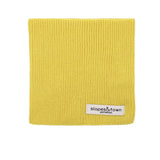 Kids merino wool snood in yellow, front view with Slopes and Town Amsterdam woven label