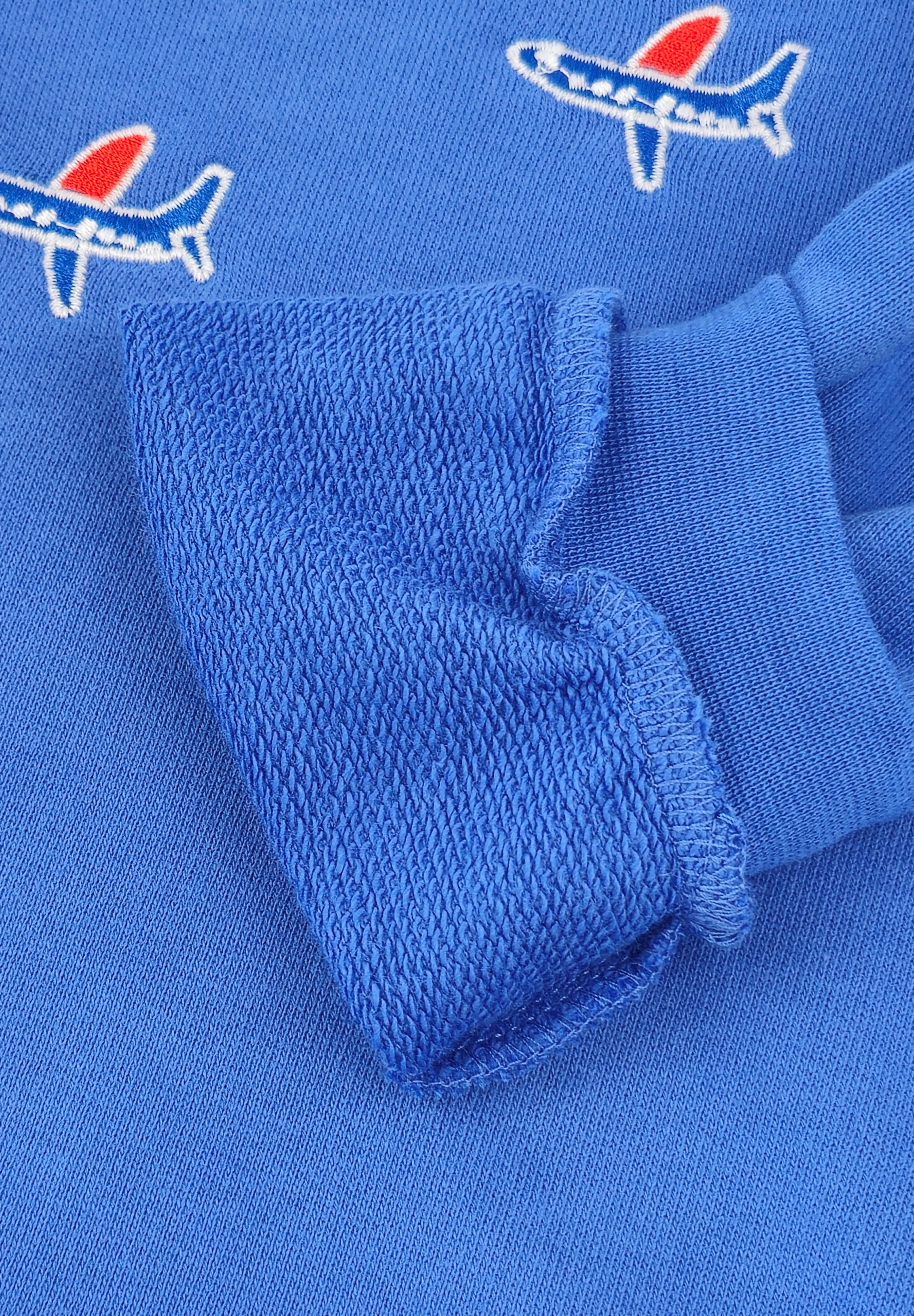 Kids organic cotton sweatshirt with embroidered airplane design