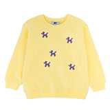 Slopes and Town kids' lemon yellow organic cotton sweatshirt with embroidered balloon dog design, front view